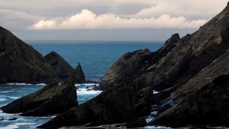 Majestic Coastal Formation Under Dramatic Skies wallpaper