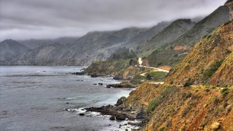 Serene Coastal Cliffs with Overcast Skies wallpaper
