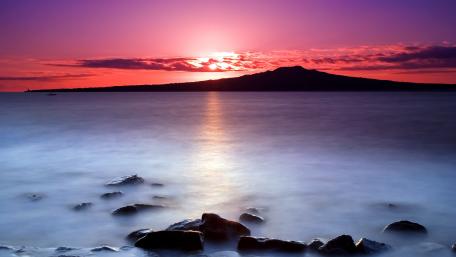 Serene Sunrise Over Coastal Waters wallpaper