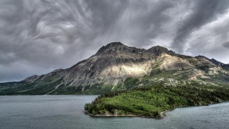 Majestic Mountains Under Dramatic Skies wallpaper