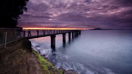 Serene Sunset Over Pier and Clouds wallpaper