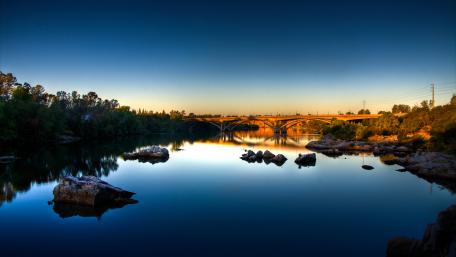 Serene River Reflections Under Twilight Sky wallpaper