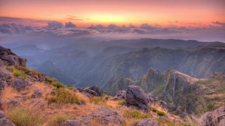 Majestic Mountain Sunrise Over Valleys and Hills wallpaper