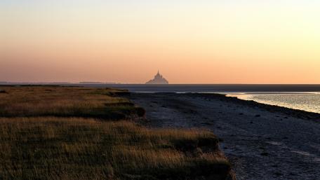 Serene Sunset at Mont Saint-Michel Coastline wallpaper
