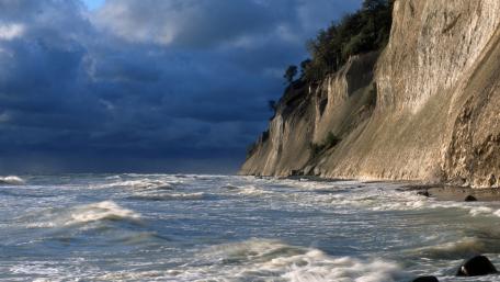 Majestic Coastal Cliffs and Turbulent Waves wallpaper
