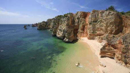 Stunning Coastal Cliffs and Serene Waters wallpaper