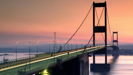 Majestic Sunset Over the City Bridge wallpaper