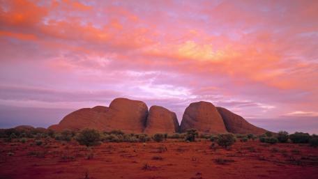 Majestic Red Rock Formations Under a Colorful Sky wallpaper