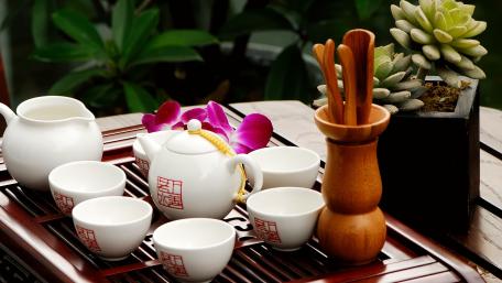 Tranquil Tea Set in Nature's Embrace wallpaper
