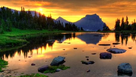 Serene Sunset Over a Tranquil Lake wallpaper