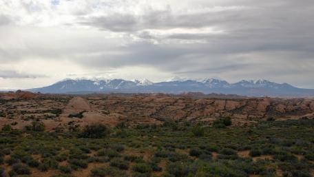 Majestic Mountain Range Under Dramatic Skies wallpaper