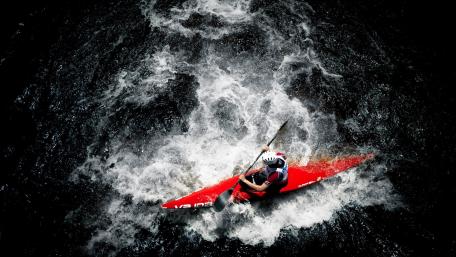 Kayaking Adventure in Turbulent Waters wallpaper
