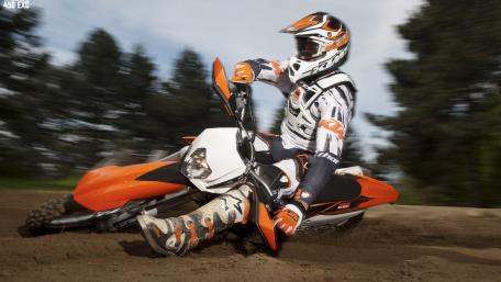 Thrilling Dirt Bike Action in Motion wallpaper