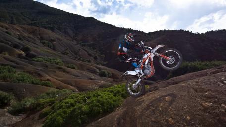 Extreme Motorcycle Adventure in Rugged Terrain wallpaper