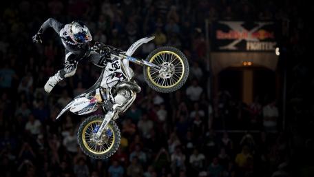 Thrilling Motocross Stunt in Action wallpaper