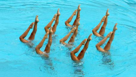Synchronised Swimmers in Graceful Harmony wallpaper