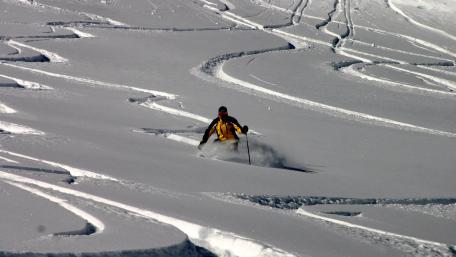 Epic Powder Skiing Adventure in the Mountains wallpaper