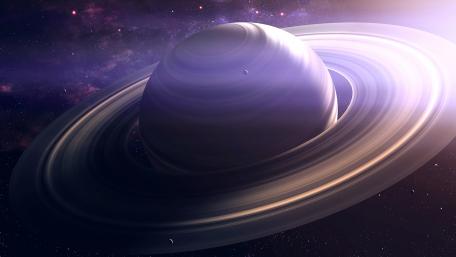 Majestic Ringed Planet Against Cosmic Background wallpaper