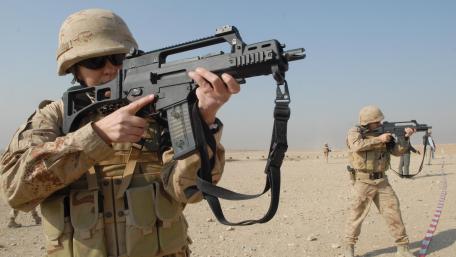 Soldiers in Action on a Desert Battlefield wallpaper