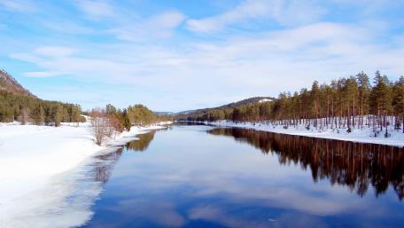 Serene Winter Landscape by Tranquil River wallpaper