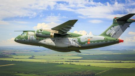 Military Aircraft in Flight Over Landscape wallpaper