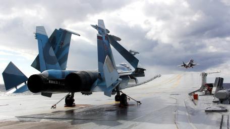Stunning Military Jet on Aircraft Carrier Deck wallpaper