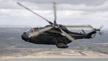 Sleek Military Helicopter in Action wallpaper