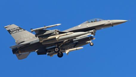 Fighter Jet in Flight Over Clear Blue Sky wallpaper