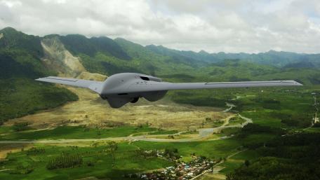 Advanced Military Drone Aerial View of Mountainous Landscape wallpaper