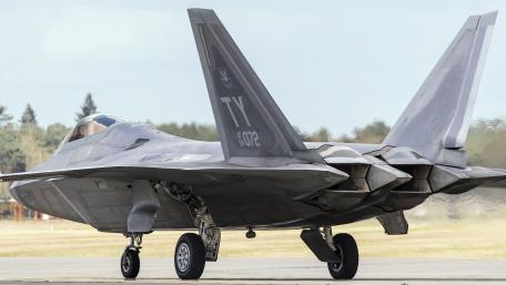 Futuristic Military Aircraft in Motion 4K Wallpaper wallpaper