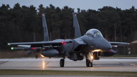 Fighter Jet Takes Flight in Twilight Scene wallpaper