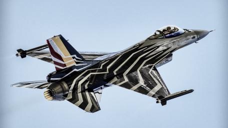 Futuristic Fighter Jet in Action wallpaper