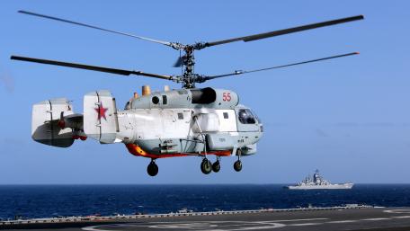 Military Helicopter in Action Over the Sea wallpaper