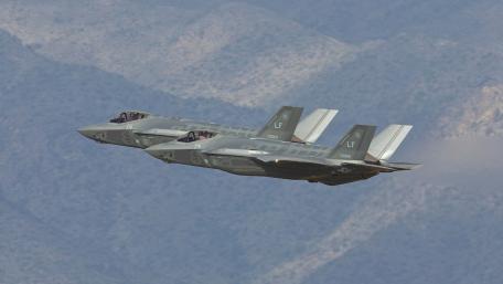 Futuristic Fighter Jets in Action wallpaper