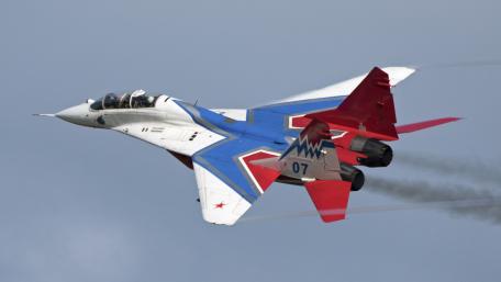 Soviet Jet Fighter in Dynamic Flight Display wallpaper