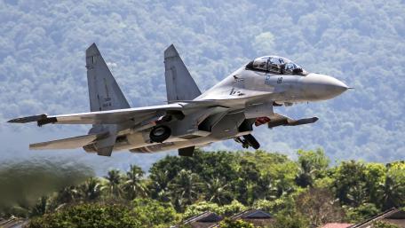 Fighter Jet in Action Above the Jungle wallpaper