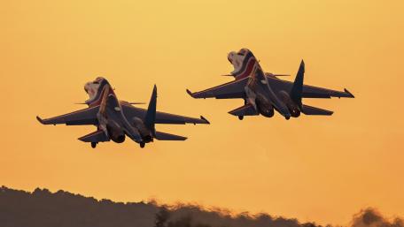 Thunderous Ascent of Jet Fighters at Dusk wallpaper