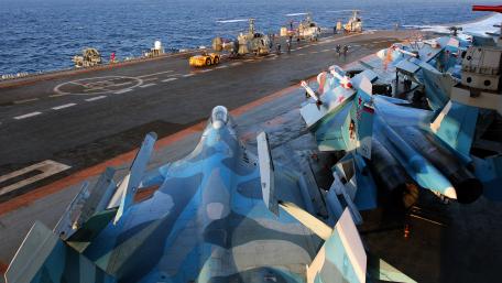 Military Aircraft Ready for Action at Sea wallpaper