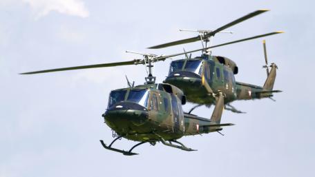 Military Helicopters in Action Above the Clouds wallpaper