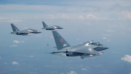 Sleek Military Jets in Formation Above the Clouds wallpaper