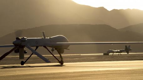 Military Drones on the Airfield at Sunset wallpaper