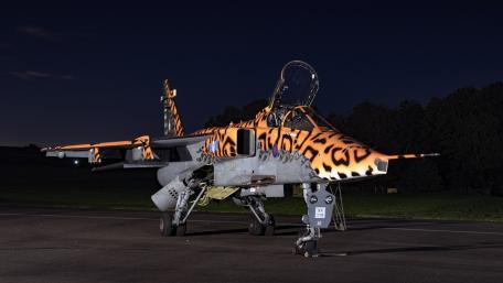Fierce Nighttime Tiger Stripes on Jet Fighter wallpaper