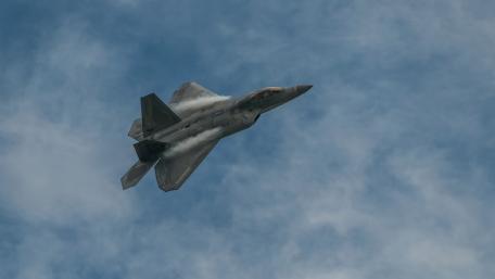 Fighter Jet in Action Above the Clouds wallpaper