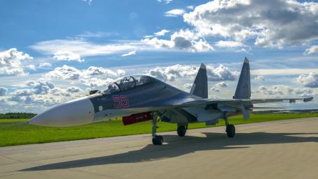 Sleek Su-57 Fighter Jet on Airfield wallpaper