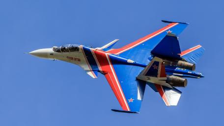 Sleek Fighter Jet in Mid-flight Display wallpaper