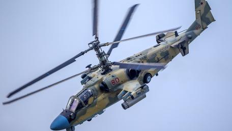 Military Helicopter in Mid-Flight Action wallpaper