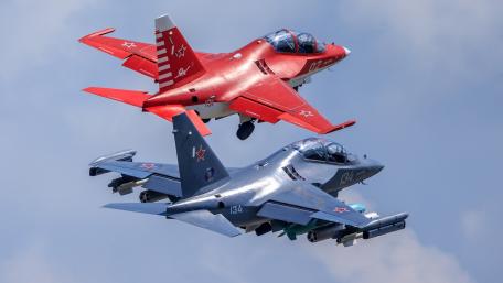 Dynamic Airborne Duo in Military Action wallpaper