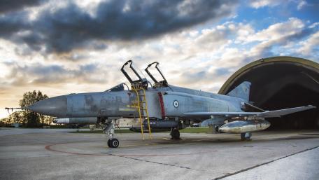 Military Aircraft at Sunset Airport Scene wallpaper