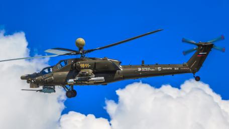 Military Helicopter in Action Against a Blue Sky wallpaper