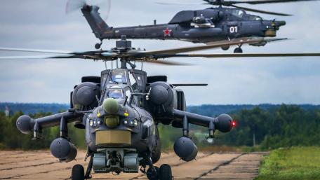 Dynamic Helicopter Warfare Scene Detailing Modern Military Aviation Techniques wallpaper